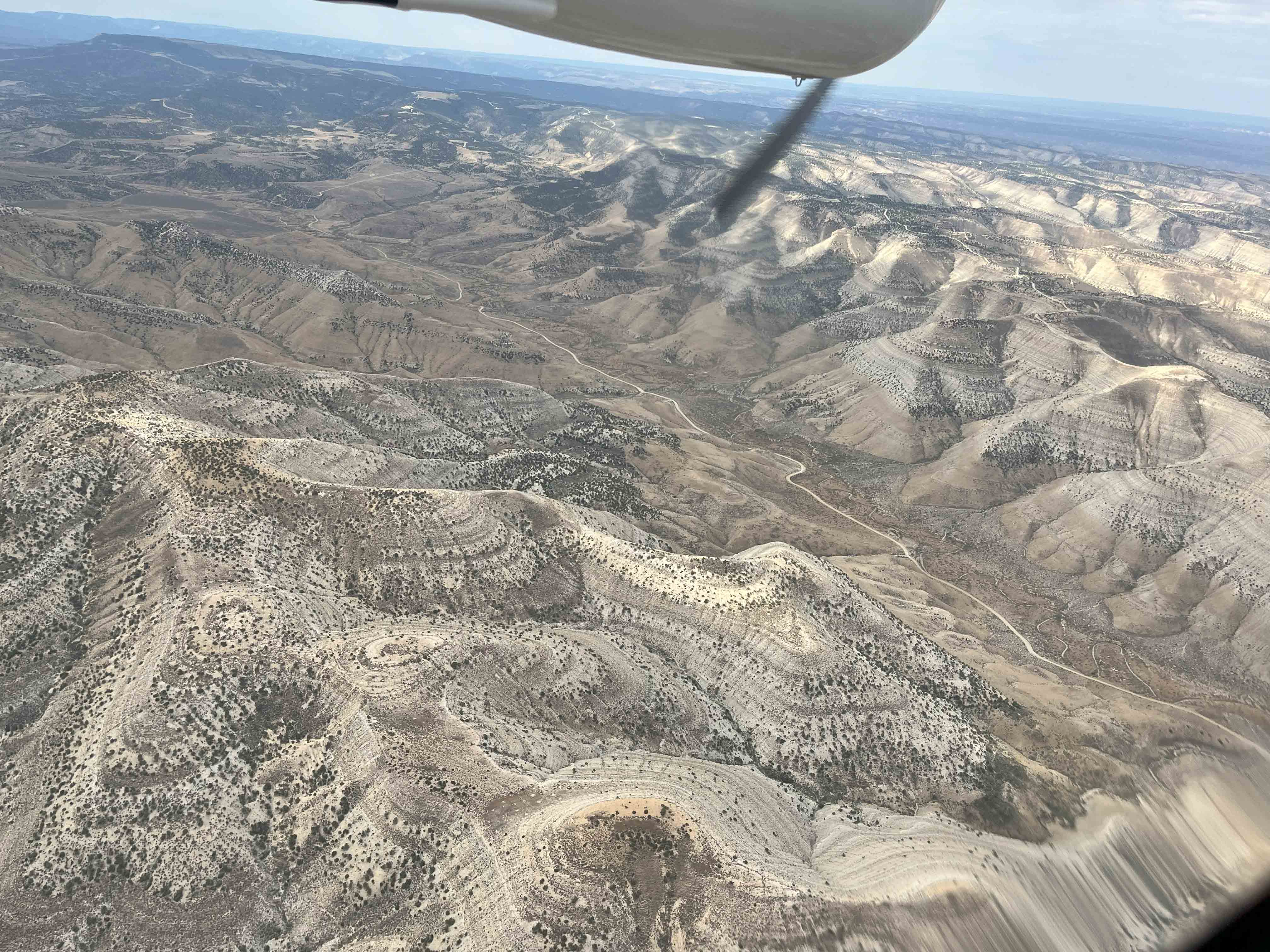 photo from a propeller plane of hilly landscape