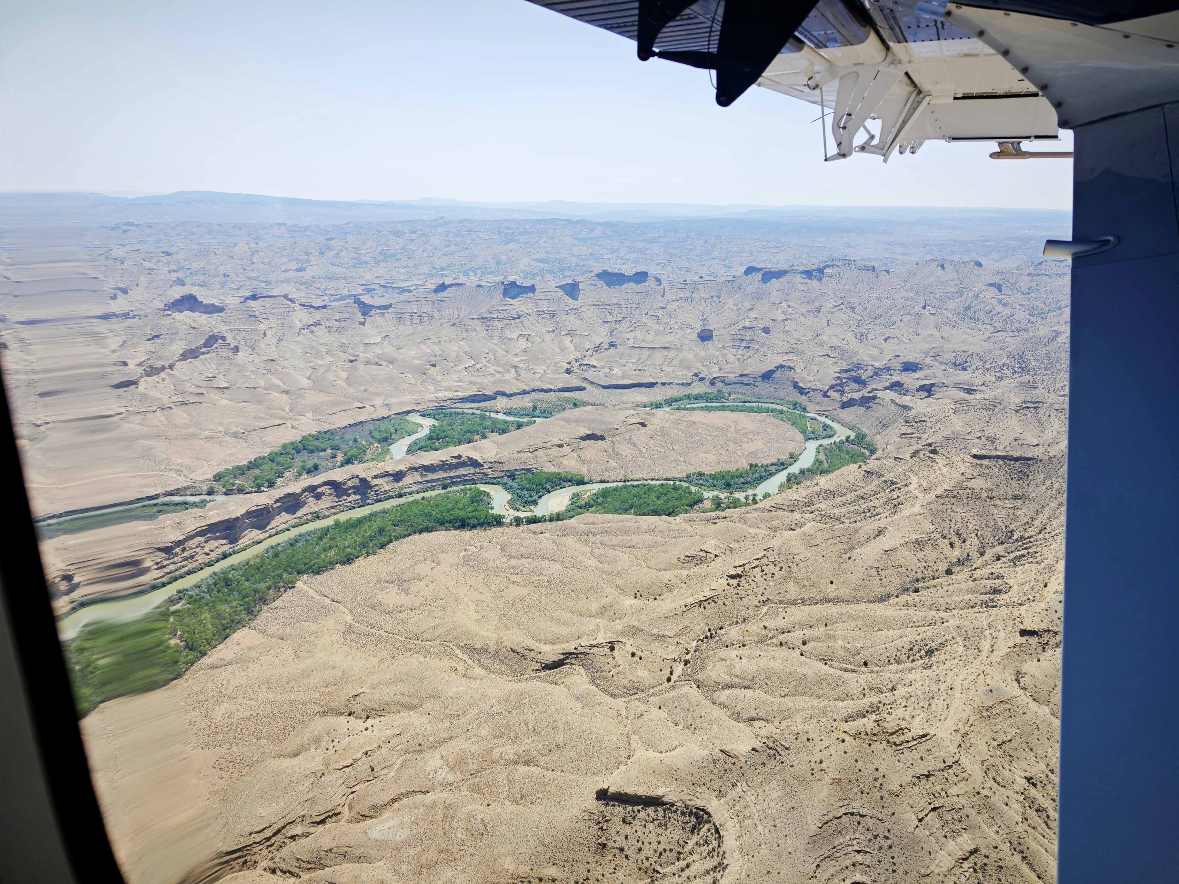 aerial view of a river snaking through desert