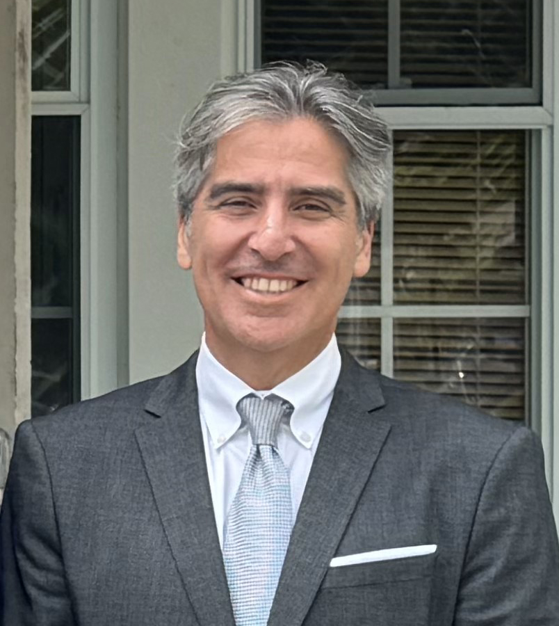 headshot of a man in a suit